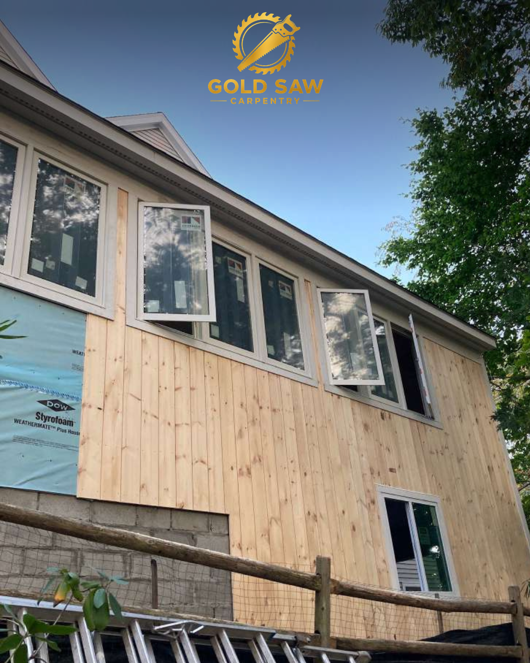 Cedar siding and window installation